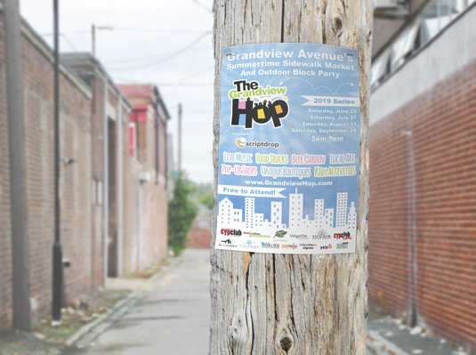 Color flyer advertisement on telephone pole on city street